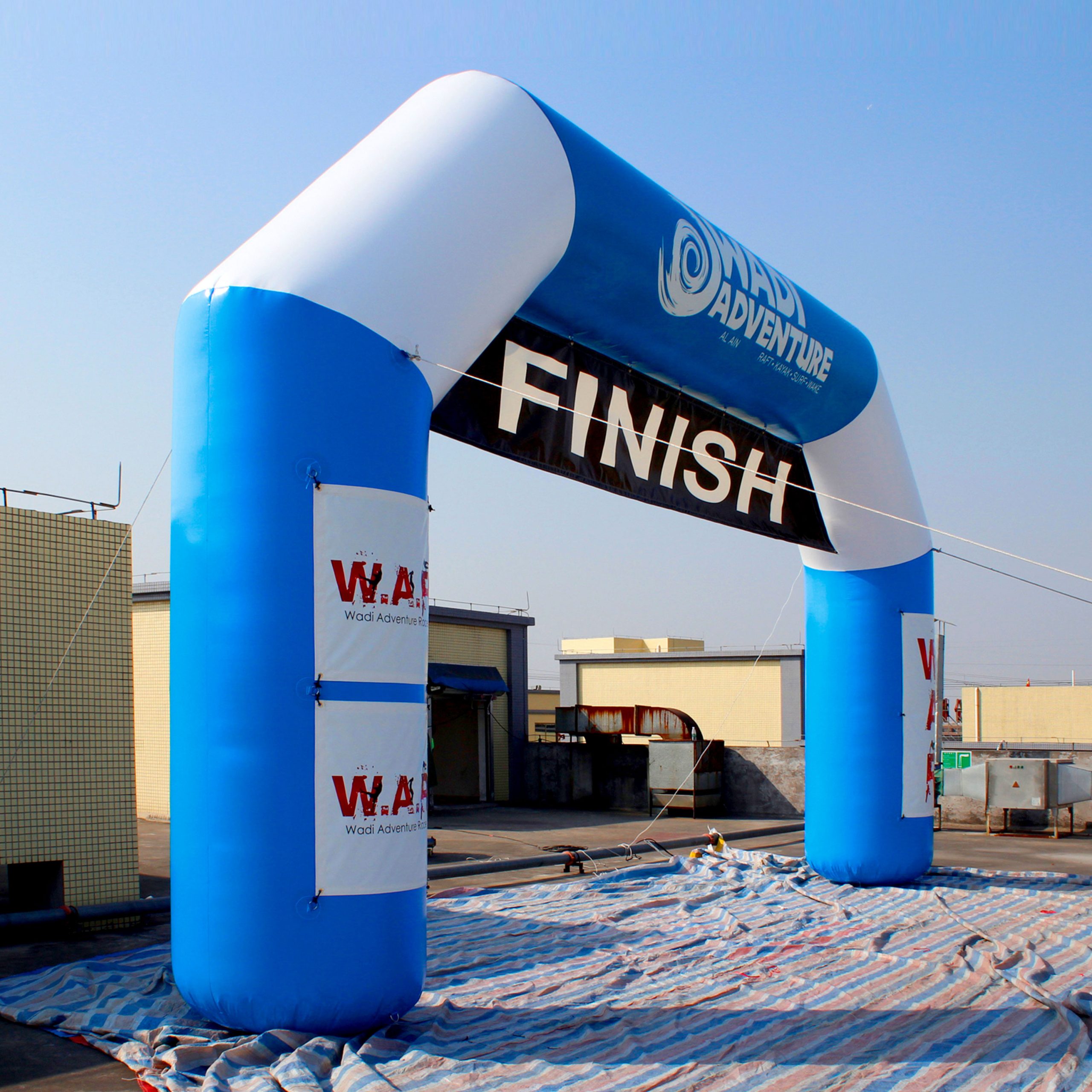 A large, vibrant inflatable archway creates a festive atmosphere