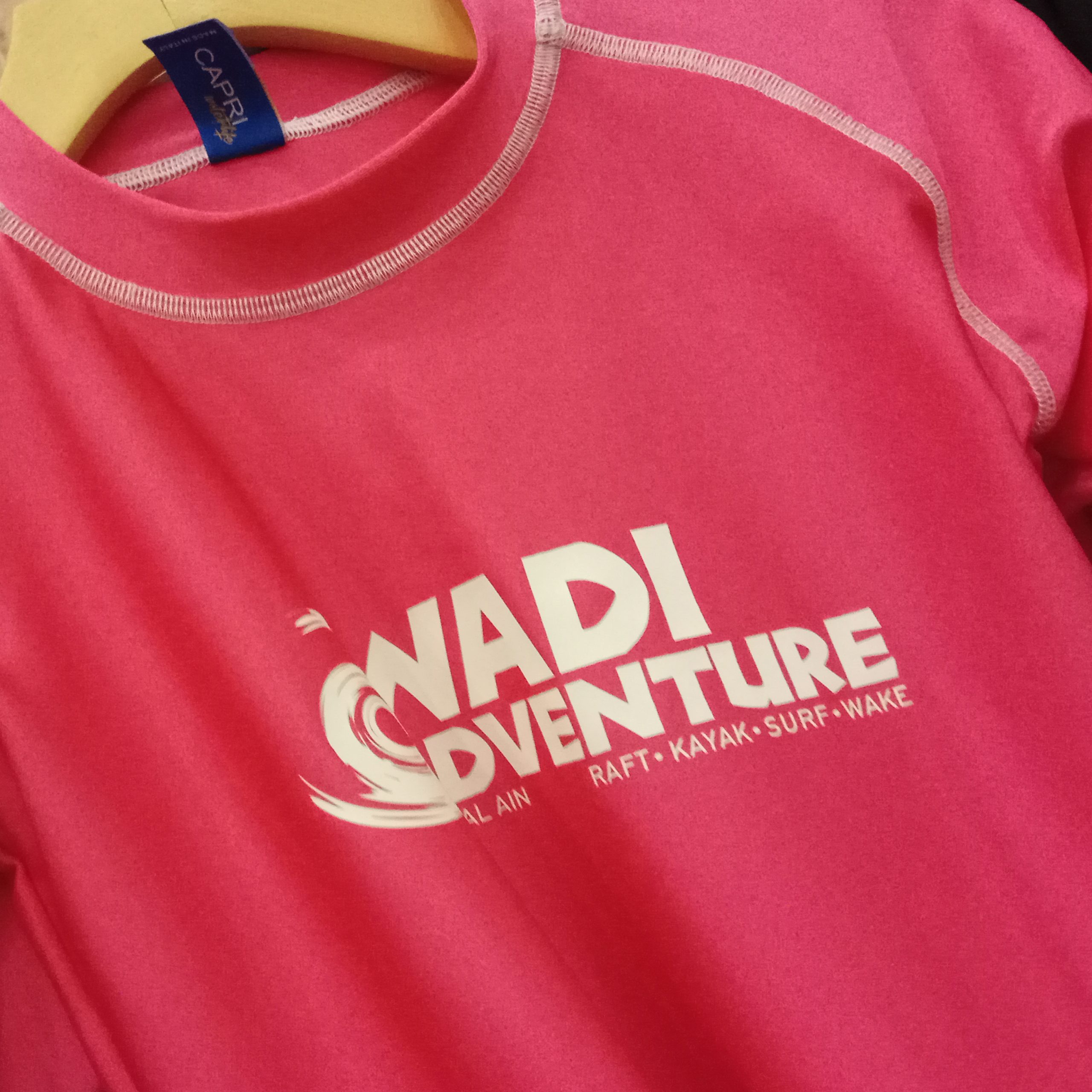 A pink shirt featuring the text "Wadi Adventure